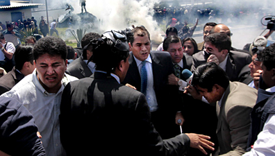 President Rafael Correa, center, during the confrontation with rebel police officers